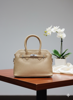 The Audrey Structured Dome Satchel.