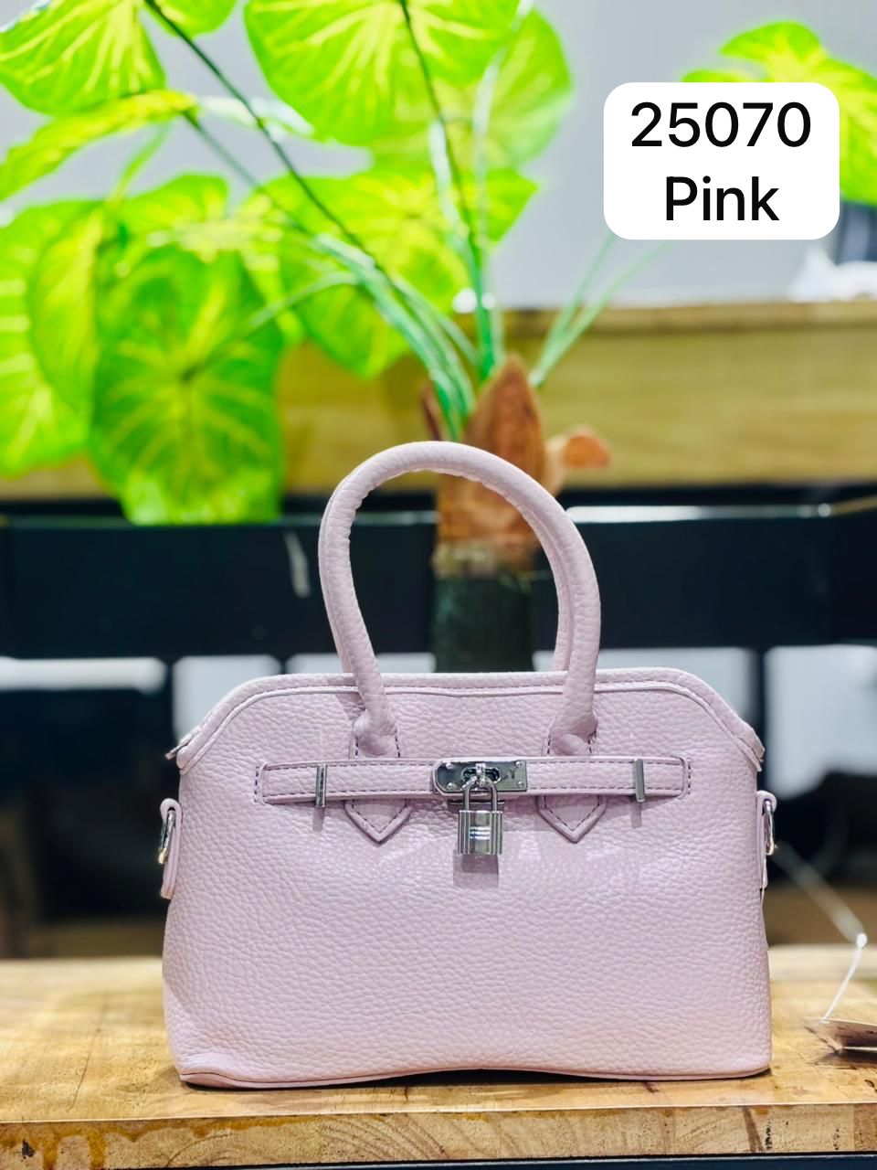 The Audrey Structured Dome Satchel.